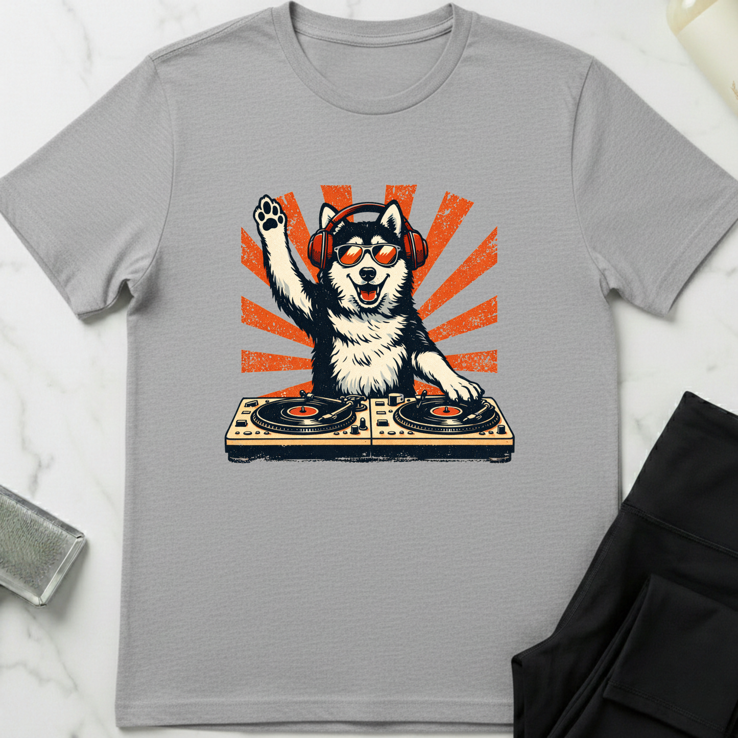 Gray t-shirt with a dog DJ graphic on a white background. Minimalist dog apparel by pemuyo.