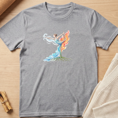 A heather gray short-sleeve crewneck t-shirt laid flat on a light wood surface, featuring a colorful graphic of a female dancer whose body forms a tree with roots and flowing blue and orange flames. Minimalist yoga apparel by pemuyo.