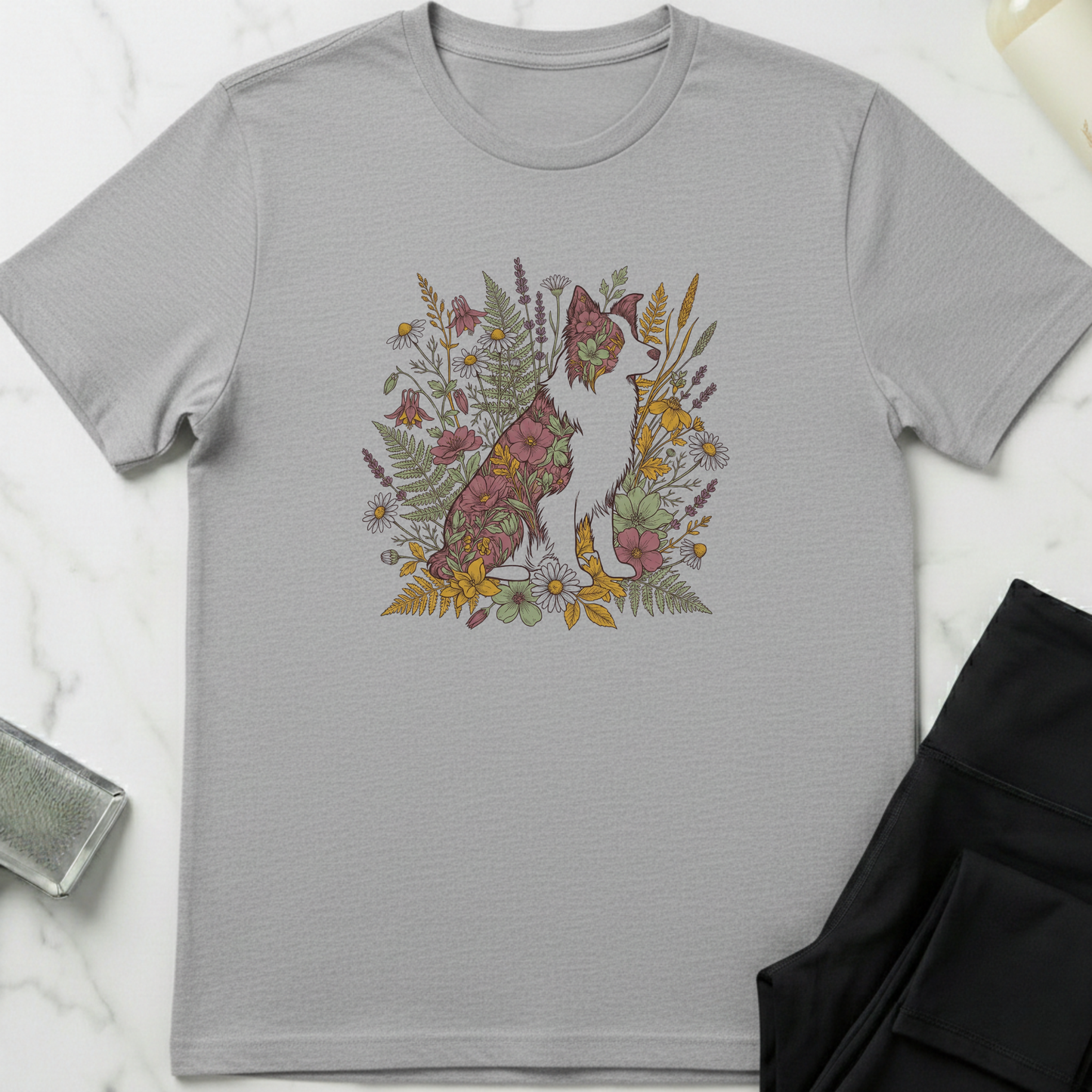 Gray t-shirt with a floral fox design on a marble surface. Minimalist dog apparel by pemuyo.