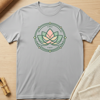 Gray t-shirt with a lotus flower design on a wooden surface. Minimalist yoga apparel by pemuyo.