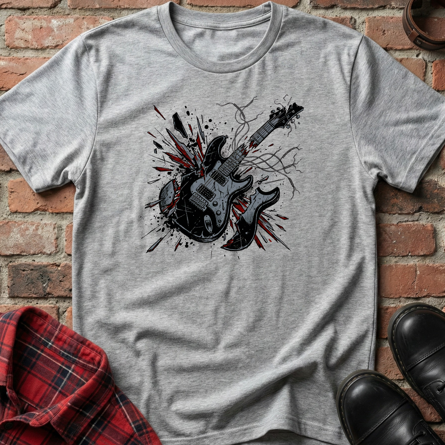Gray t-shirt with a guitar graphic on a brick background. Minimalist music apparel by pemuyo.