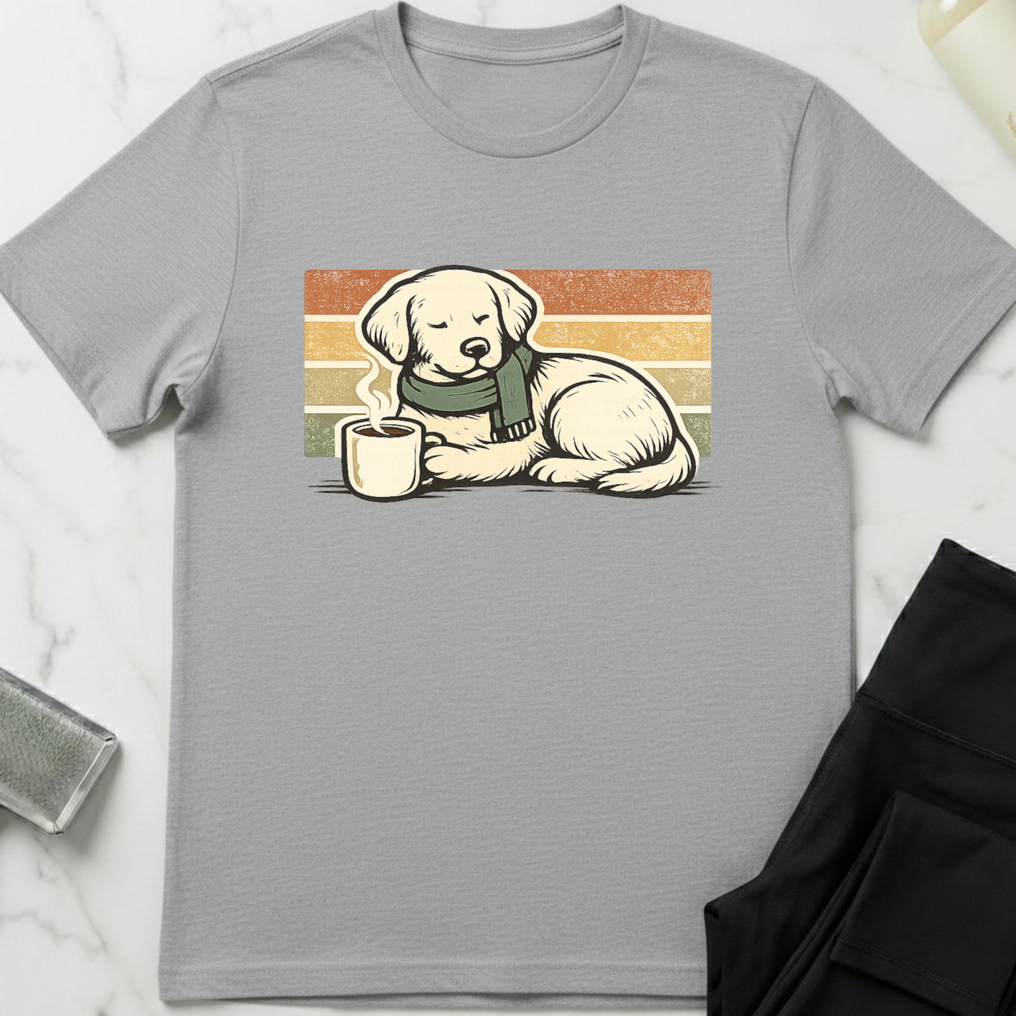Gray t-shirt with a dog graphic holding a mug on a white background. Minimalist dog apparel by pemuyo.