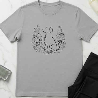 Gray t-shirt with a dog silhouette and floral wreath design on a marble surface. Minimalist dog apparel by pemuyo.