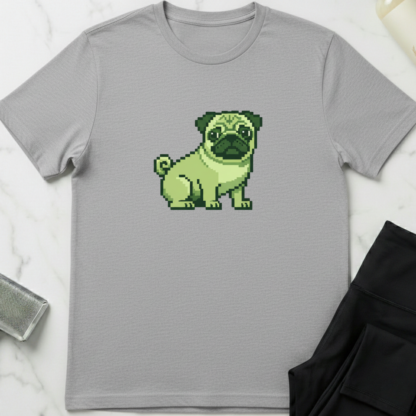 Gray t-shirt with a pixelated green pug design on a light gray background. Minimalist dog apparel by pemuyo.