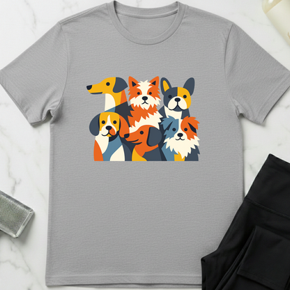 Gray t-shirt with colorful dog illustrations on a white marble surface. Minimalist dog apparel by pemuyo.