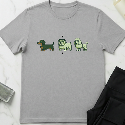 Gray t-shirt with pixelated dog illustrations on a white marble surface. Minimalist dog apparel by pemuyo.