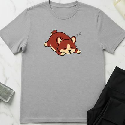 Gray t-shirt with a cartoon dog design on a marble surface. Minimalist dog apparel by pemuyo.