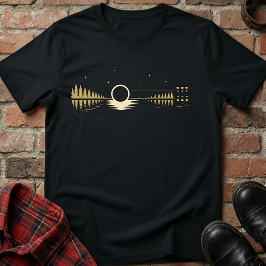 Black t-shirt with a guitar design on a brick background. Minimalist music apparel by pemuyo.
