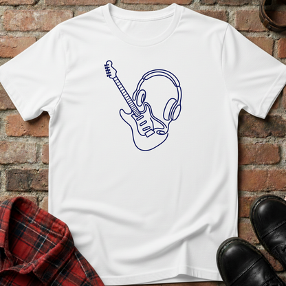 White t-shirt with a graphic design of a guitar and headphones on a brick surface. Minimalist music apparel by pemuyo.