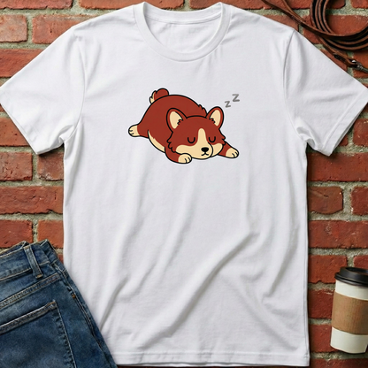 White t-shirt with a cartoon dog design on a brick wall background. Minimalist dog apparel by pemuyo.