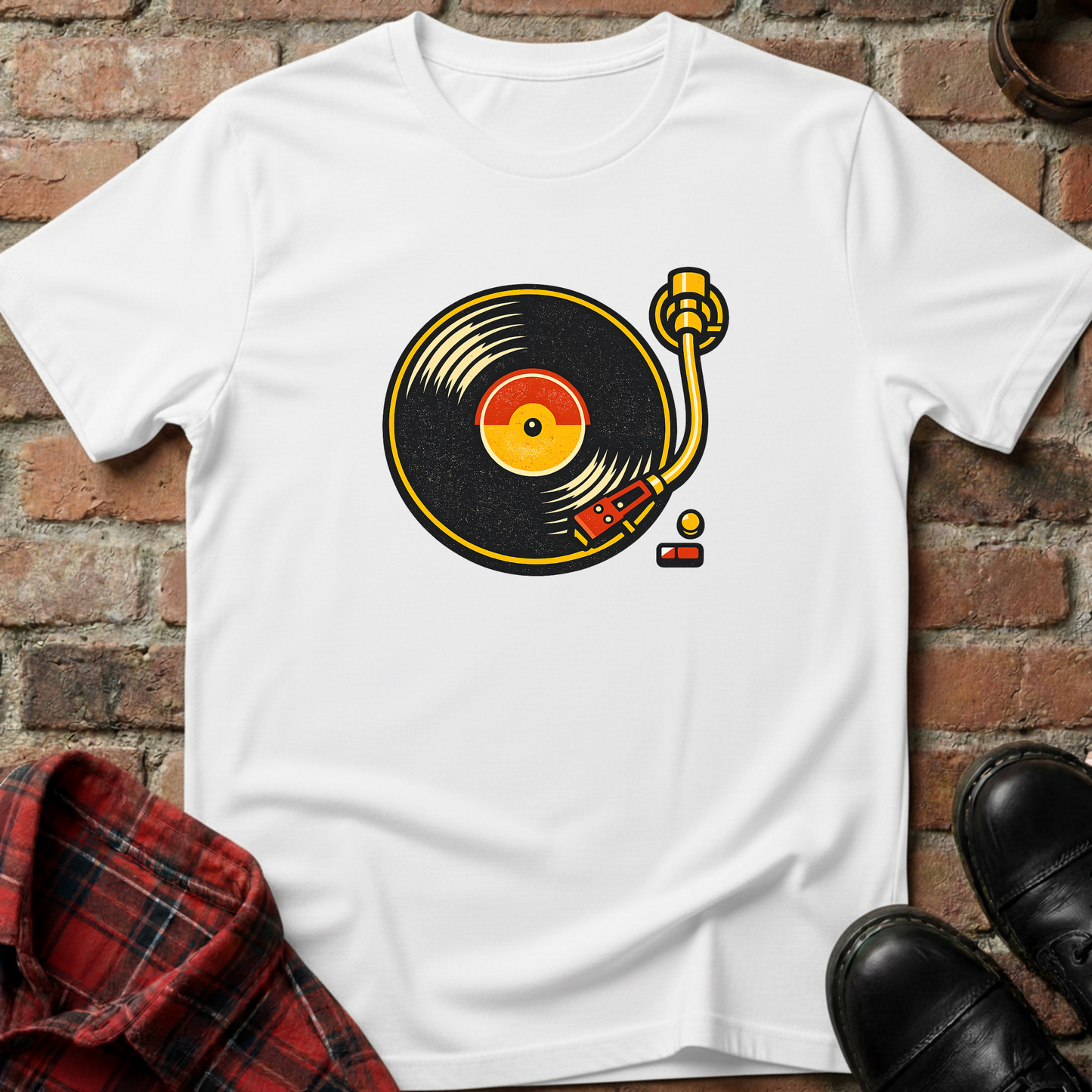 White t-shirt with a vinyl record design on a brick surface. Minimalist music apparel by pemuyo.