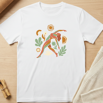 White t-shirt with a colorful abstract design on a wooden surface. Minimalist yoga apparel by pemuyo.