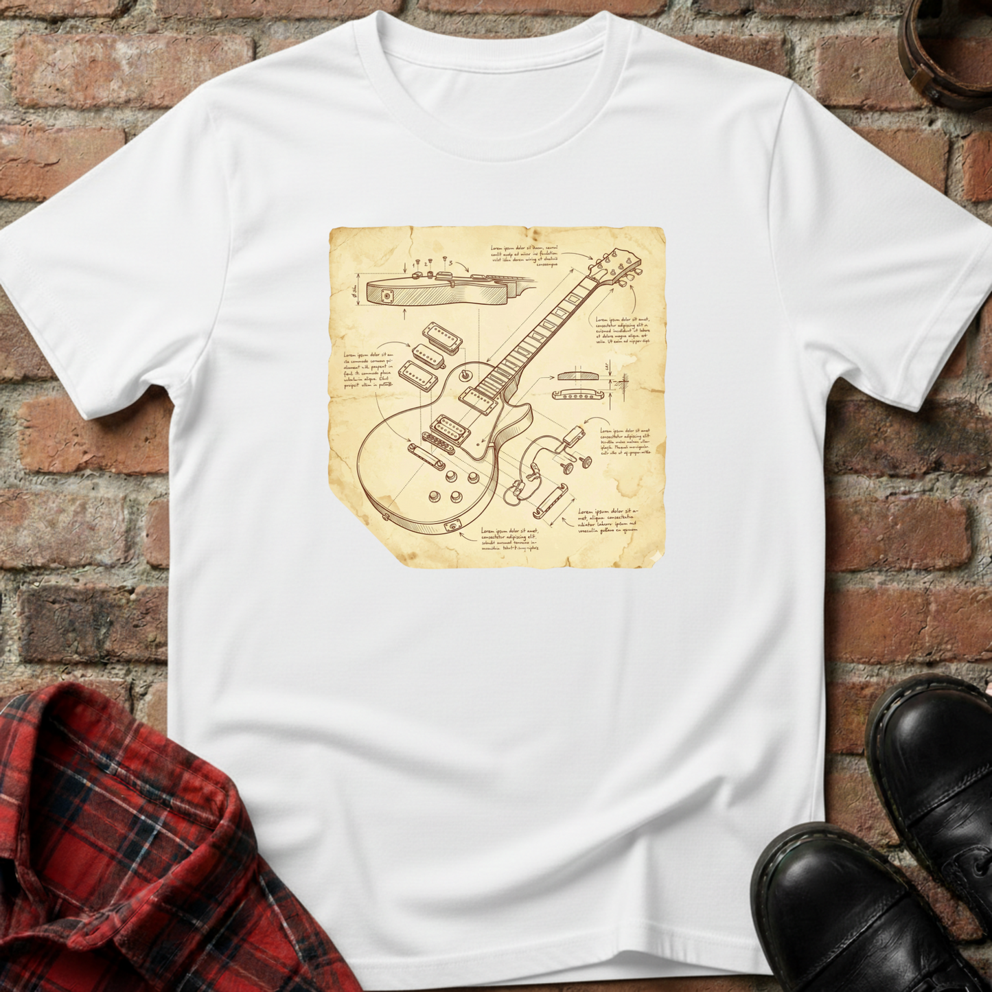 White t-shirt with guitar blueprint design on a brick surface. Minimalist music apparel by pemuyo.