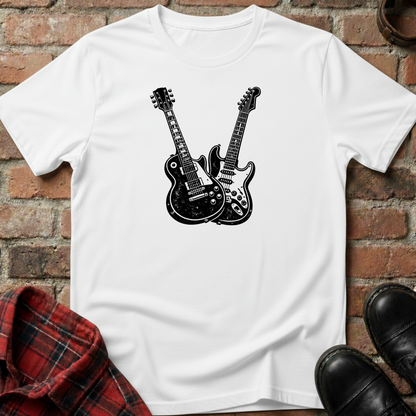 White t-shirt with black guitar design on a brick surface. Minimalist music apparel by pemuyo.