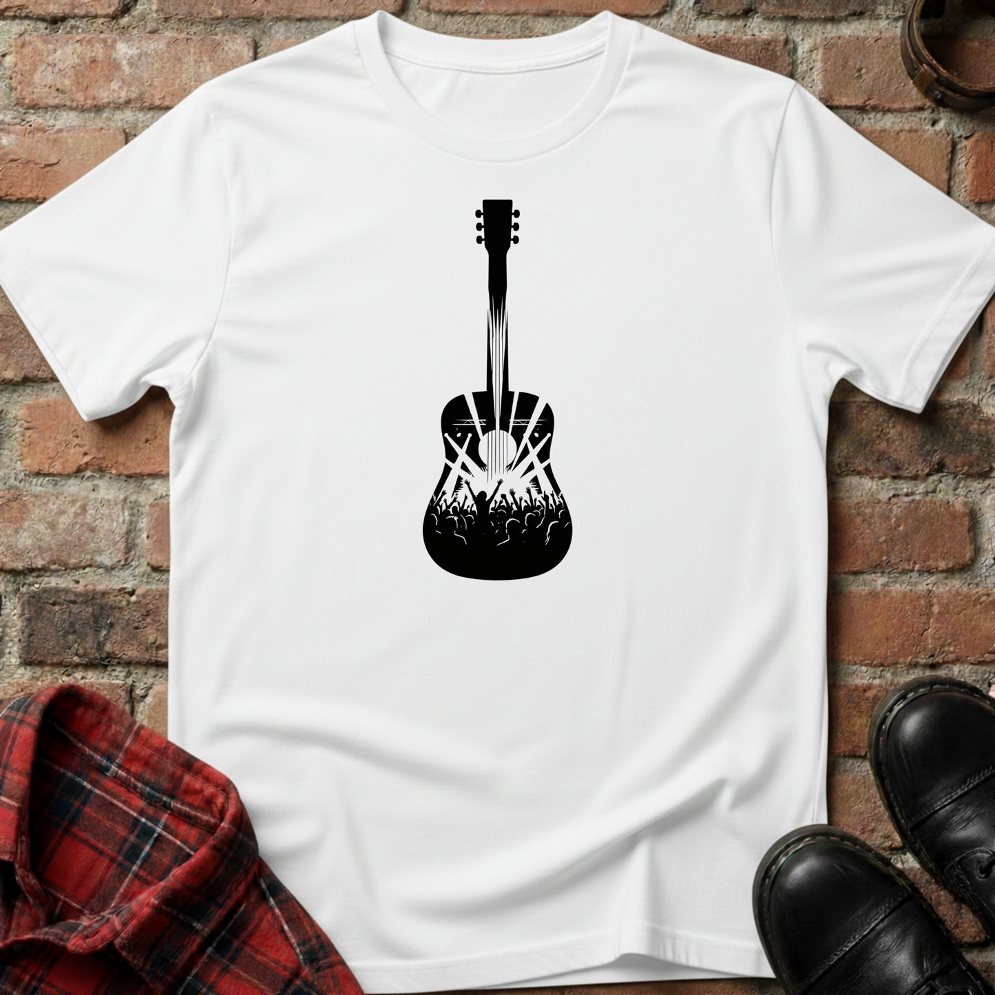 White t-shirt with black guitar graphic on a brick surface. Minimalist music apparel by pemuyo.