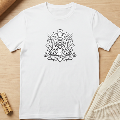 A white short-sleeve crewneck t-shirt with a black geometric line art graphic of a meditating figure, laid flat on a light wood background with neutral props. Minimalist yoga apparel by pemuyo.