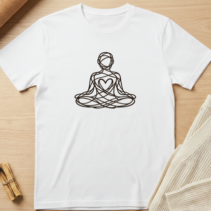 White t-shirt with a black line art design of a person in meditation on a wooden surface. Minimalist yoga apparel by pemuyo.