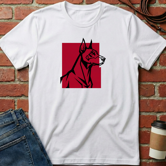 White t-shirt with a red and black dog graphic on a brick wall background. Minimalist dog apparel by pemuyo.