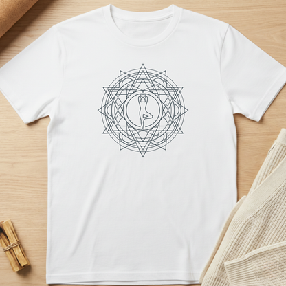 White t-shirt with a geometric design on a wooden surface. Minimalist yoga apparel by pemuyo.