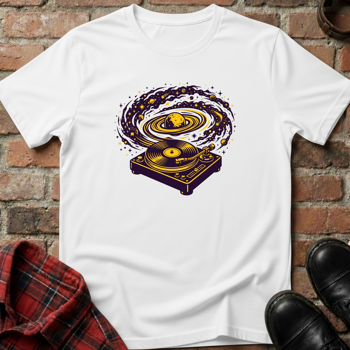 White t-shirt with a graphic design of a turntable on a brick surface. Minimalist music apparel by pemuyo.