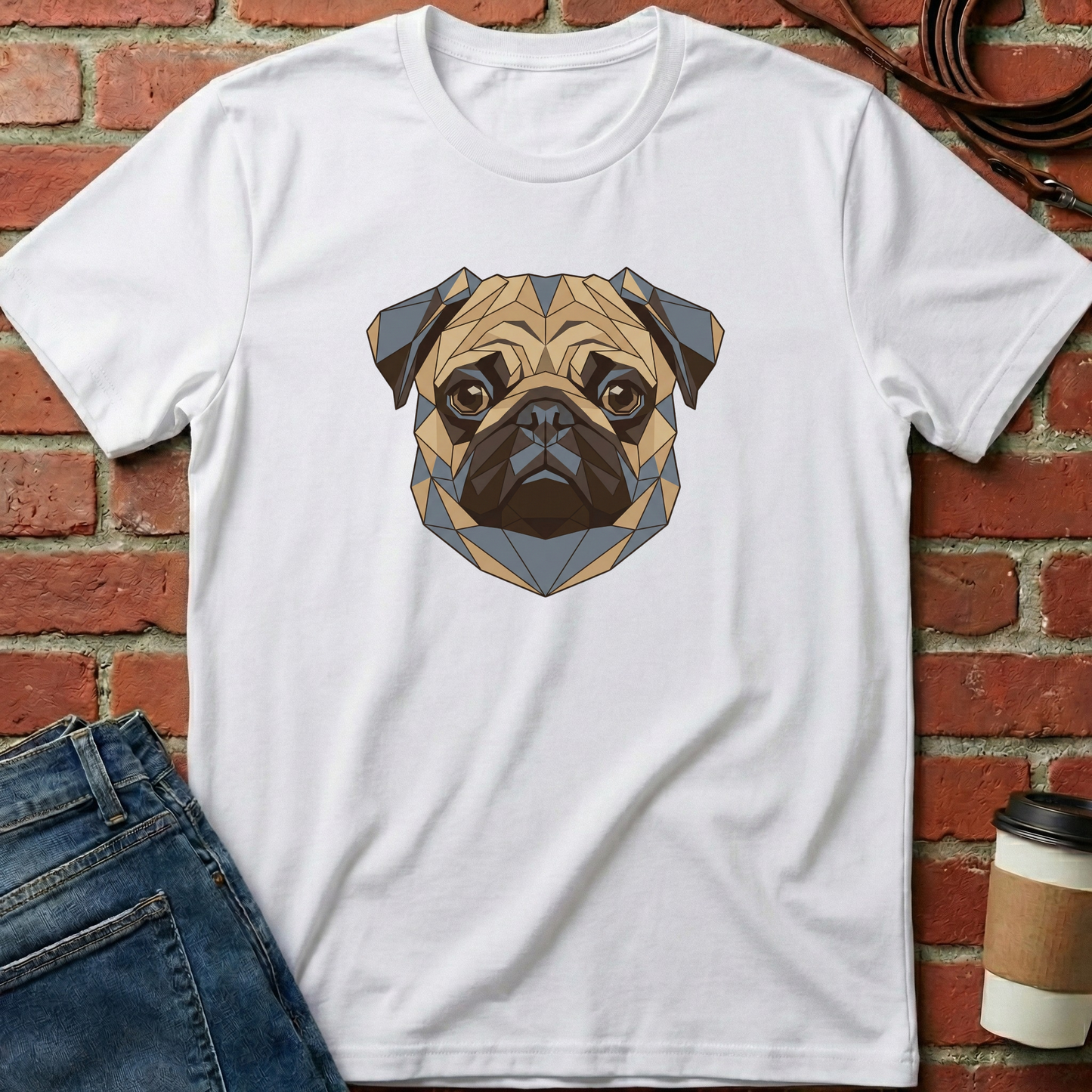White t-shirt with geometric pug design on a brick wall background. Minimalist dog apparel by pemuyo.