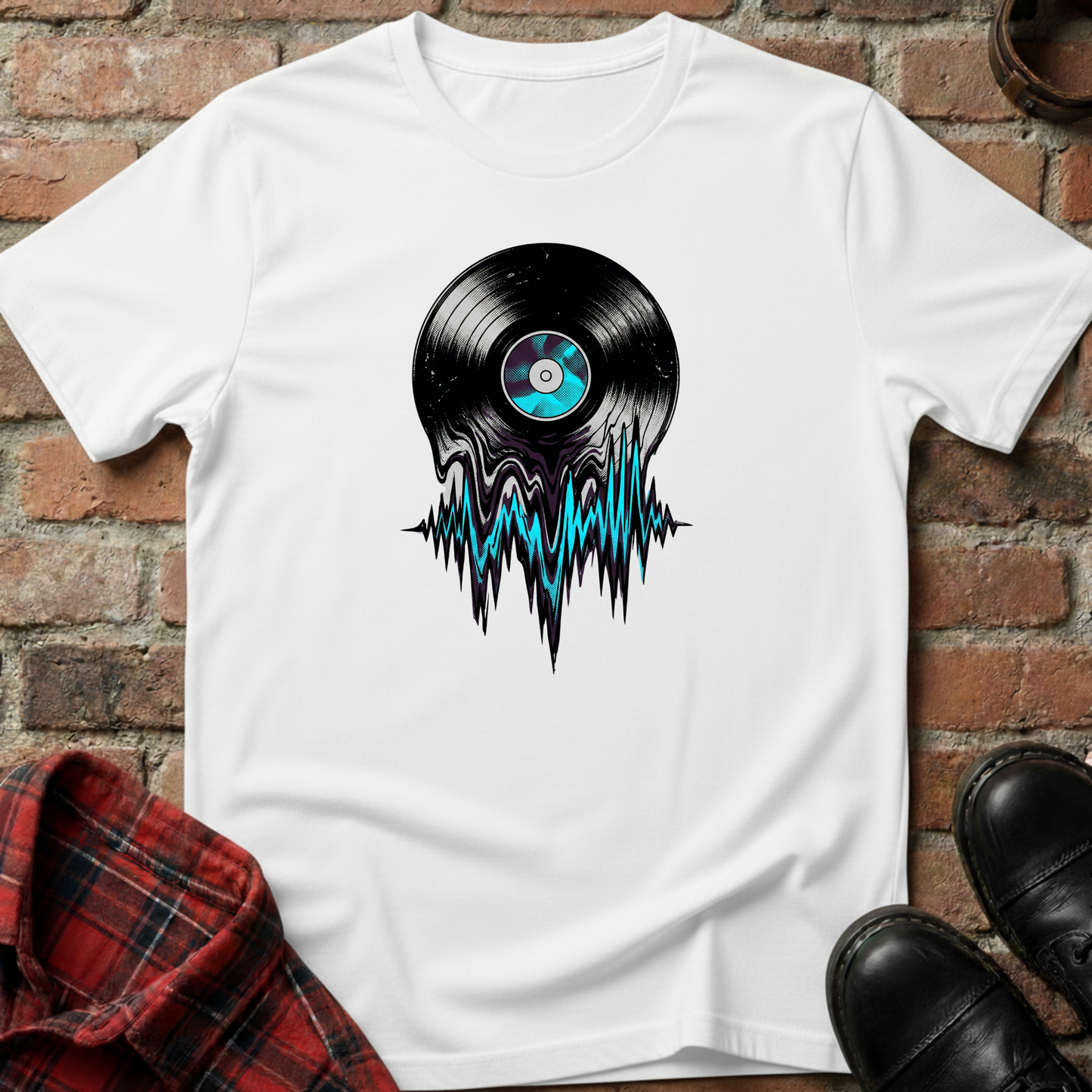 White t-shirt with vinyl record design on a brick surface. Minimalist music apparel by pemuyo.