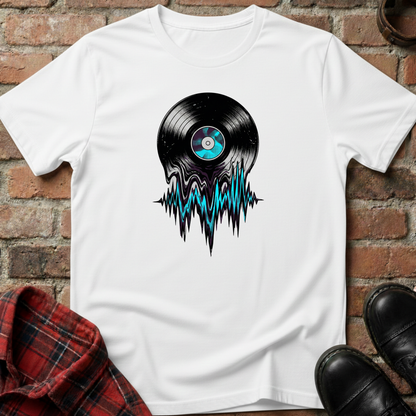 White t-shirt with vinyl record design on a brick surface. Minimalist music apparel by pemuyo.