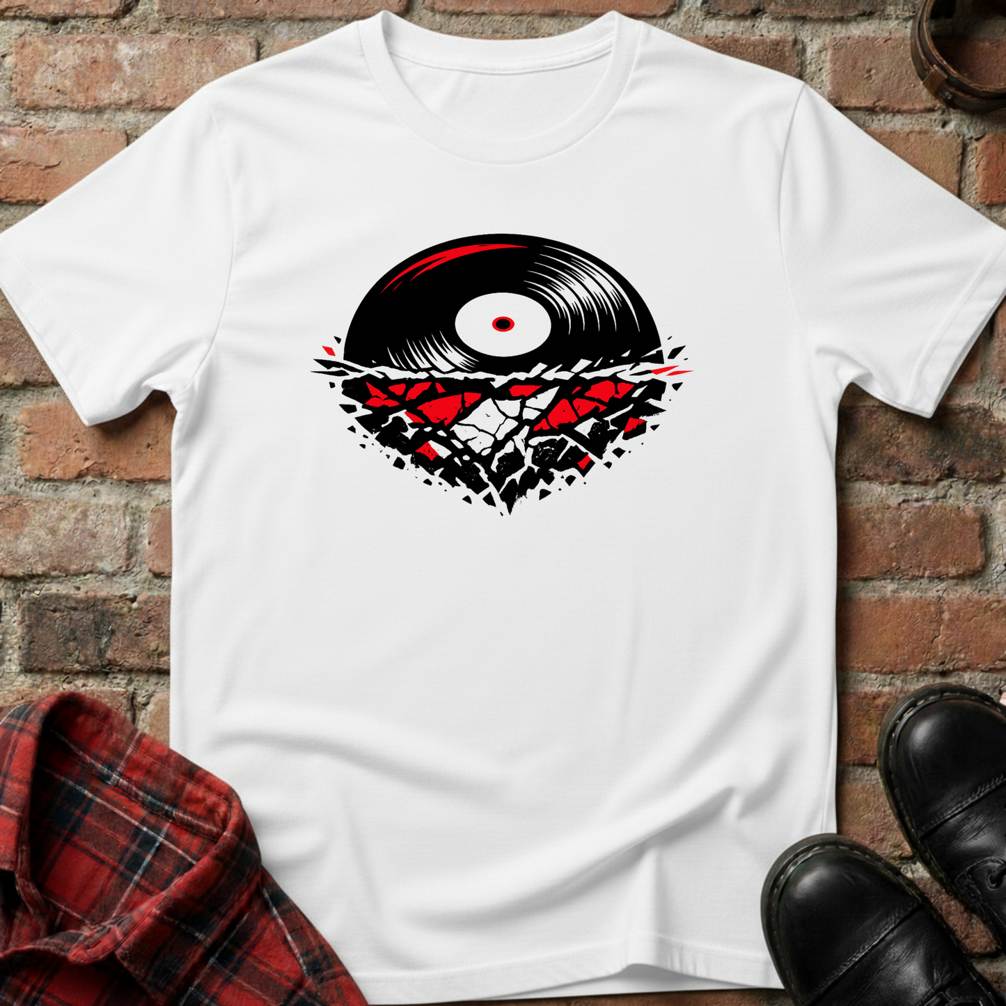 White t-shirt with vinyl record design on a brick surface. Minimalist music apparel by pemuyo.