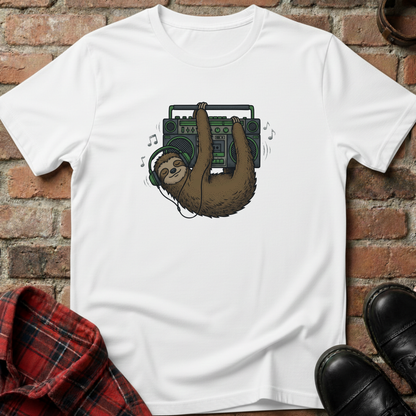 White t-shirt with a sloth holding a boombox graphic on a brick surface. Minimalist music apparel by pemuyo.