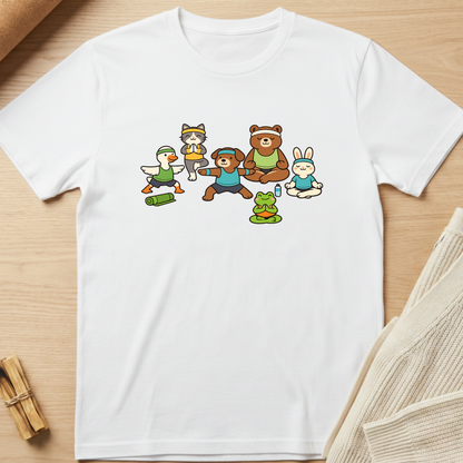 White t-shirt with cartoon characters on a wooden surface. Minimalist yoga apparel by pemuyo.