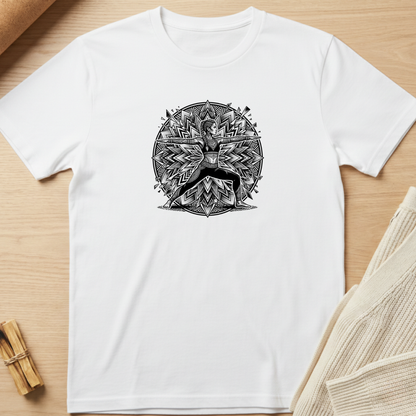 A white short-sleeve crewneck t-shirt with a black circular mandala-style graphic of a deer in the center, laid flat on a light wood background with styled props. Minimalist yoga apparel by pemuyo.