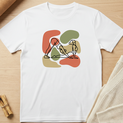 White t-shirt with abstract design of a person holding a dog on a wooden surface. Minimalist yoga apparel by pemuyo.