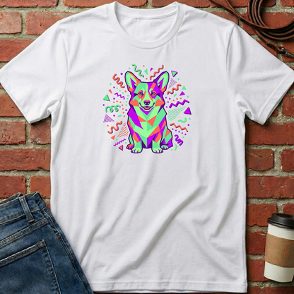 White t-shirt with a colorful dog graphic on a brick wall background. Minimalist dog apparel by pemuyo.