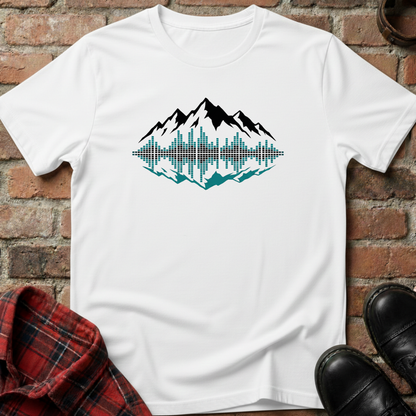 White t-shirt with mountain graphic design on a brick surface. Minimalist music apparel by pemuyo.