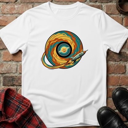 White t-shirt with space-themed graphic on a brick surface. Minimalist music apparel by pemuyo.