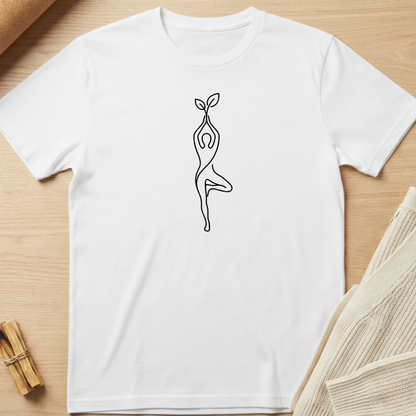 White t-shirt with a black line art design of a person holding a plant on a wooden surface. Minimalist yoga apparel by pemuyo.