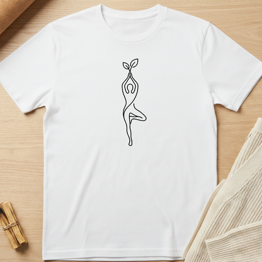 White t-shirt with a black line art design of a person holding a plant on a wooden surface. Minimalist yoga apparel by pemuyo.