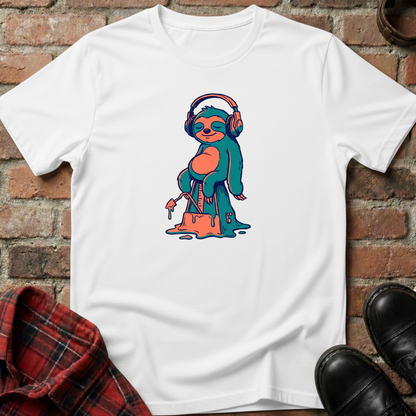 White t-shirt with a colorful sloth graphic wearing headphones on a brick surface. Minimalist music apparel by pemuyo.