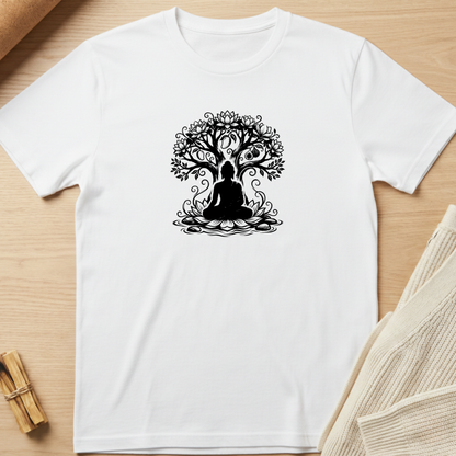 A white short-sleeve crewneck t-shirt with a black graphic of a meditating figure inside a tree, laid flat on a light wood background with a beige knit fabric prop. Minimalist yoga apparel by pemuyo.