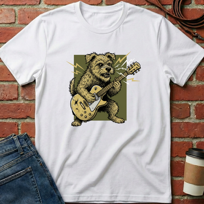 White t-shirt with a bear playing guitar graphic on a brick wall background. Minimalist dog apparel by pemuyo.