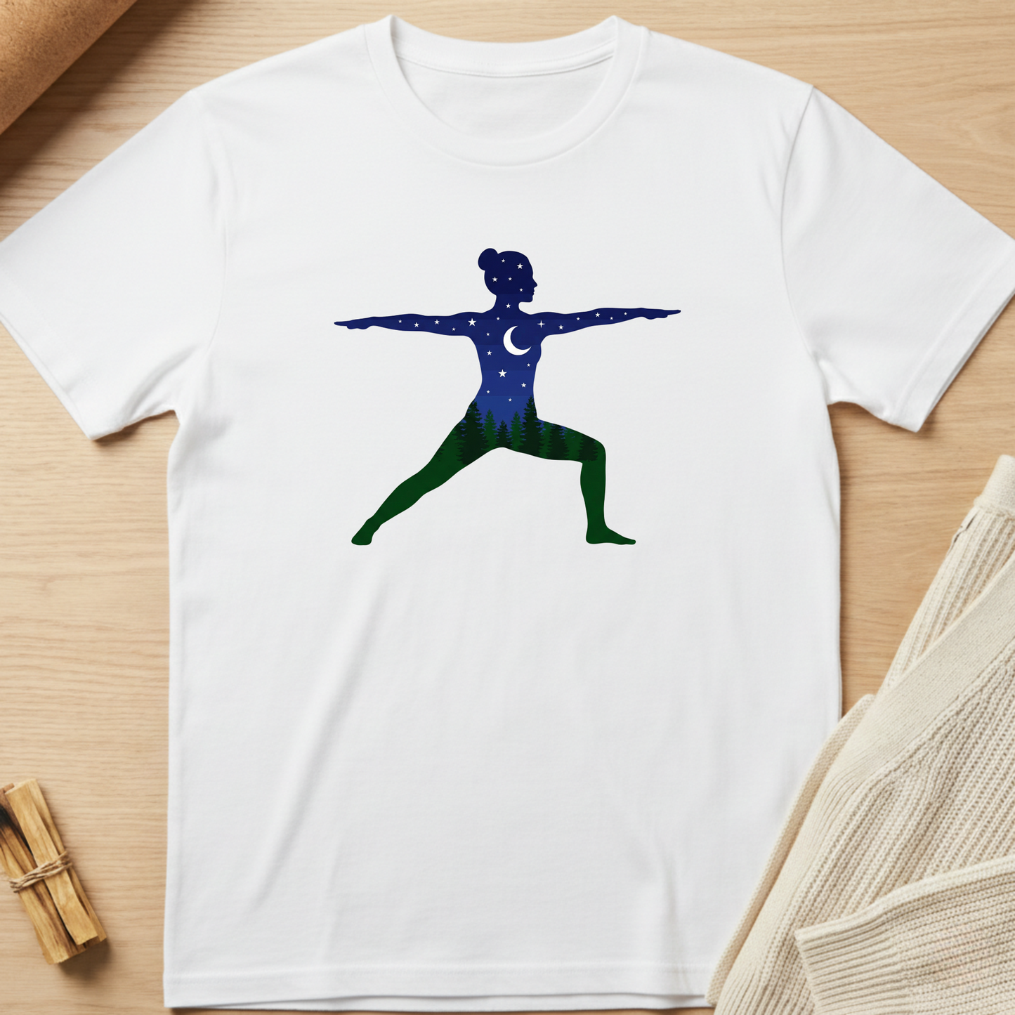 White t-shirt with a graphic design of a person in a yoga pose on a wooden surface. Minimalist yoga apparel by pemuyo.