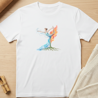 A white short-sleeve crewneck t-shirt laid flat on a light wood surface, featuring a colorful graphic of a female dancer whose body forms a tree with blue and orange flames rising from the trunk. Minimalist yoga apparel by pemuyo.