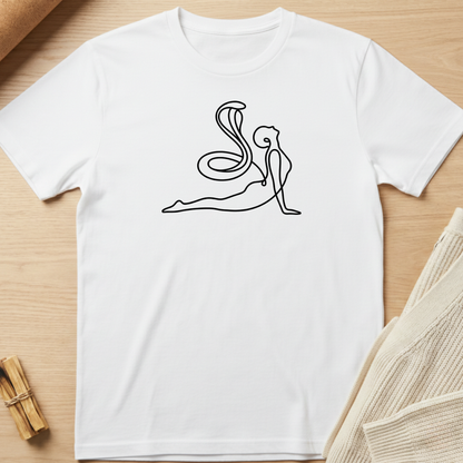 White t-shirt with a black line art design of a person in a yoga pose on a wooden surface. Minimalist yoga apparel by pemuyo.