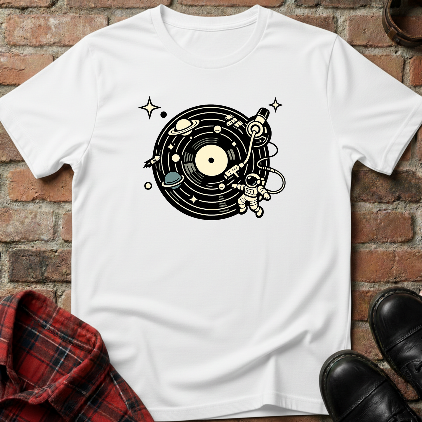 White t-shirt with vinyl record design on a brick surface. Minimalist music apparel by pemuyo.