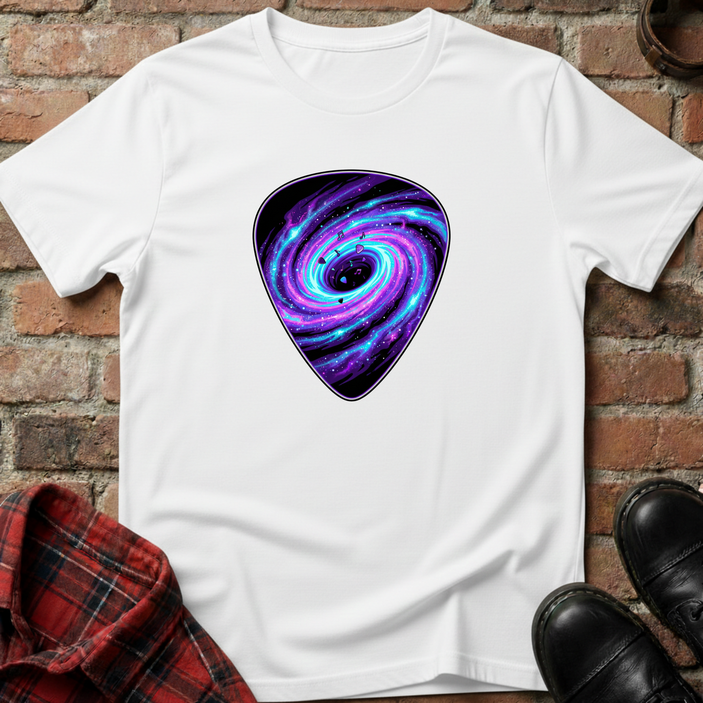White t-shirt with a purple and blue galaxy design on a brick surface. Minimalist music apparel by pemuyo.