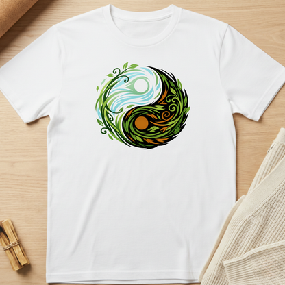 White t-shirt with a colorful yin yang design on a wooden surface. Minimalist yoga apparel by pemuyo.